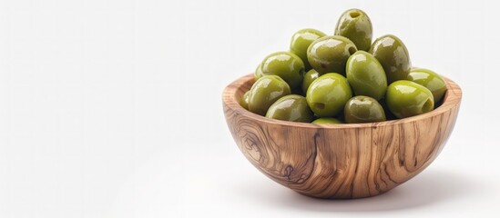 Green Olives in Wooden Bowl