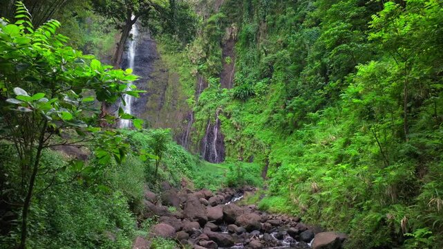 Faarumai Valley Waterfall Falls Tahiti Island French Polynesia aerial drone Three Waterfalls Trail Les Trios picturesque river Cascades Vaimahuta Tiarei Hitiaa watershed jungle forest backward motion