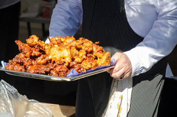 Preparing and serving food in a street kitchen