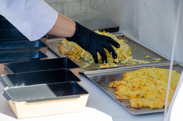 The process of cooking in an outdoor kitchen