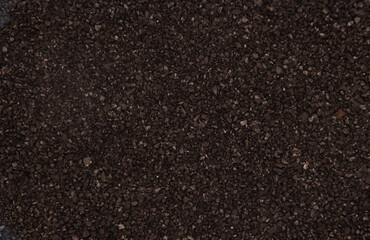 activated carbon grains texture background