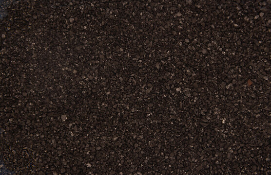 activated carbon grains texture background