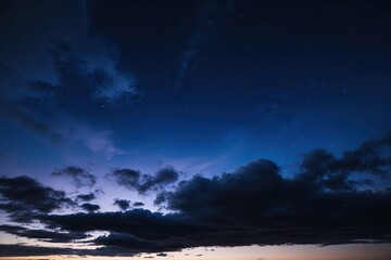 Fototapeta premium Indigo Clouds Enveloping a Peaceful Night Sky