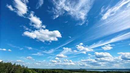 Obraz premium A bright blue sky with wispy clouds and a few scattered cumulus clouds floating above, natural scenery, atmospheric perspective, clear blue sky