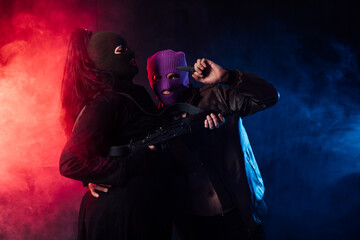 Man And Woman Bandits With Masked Guns