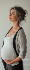 Beautiful mature woman experiencing late pregnancy. Late maternity