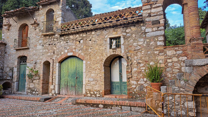 Fototapeta premium Botanical Garden – a secluded attraction of Taormina, exotic vegetation and interesting buildings