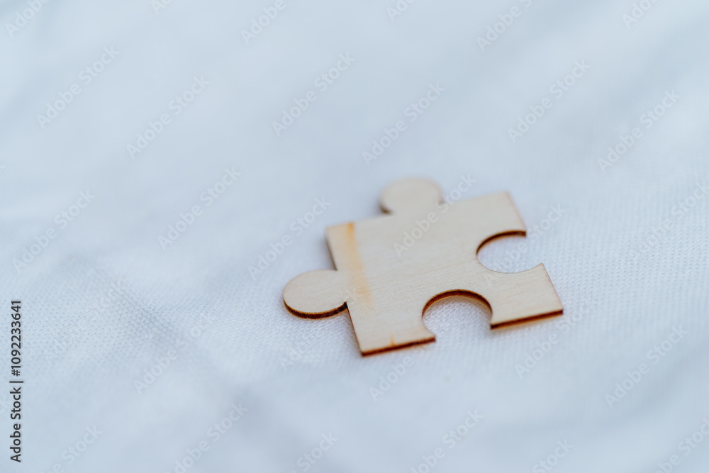 Aufkleber Solving business challenges a single puzzle piece on white background abstract concept minimalistic setting close-up view