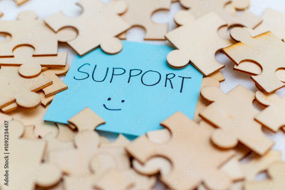 Leinwandbilder boosting business support with puzzle pieces office setting visual content bright environment close-