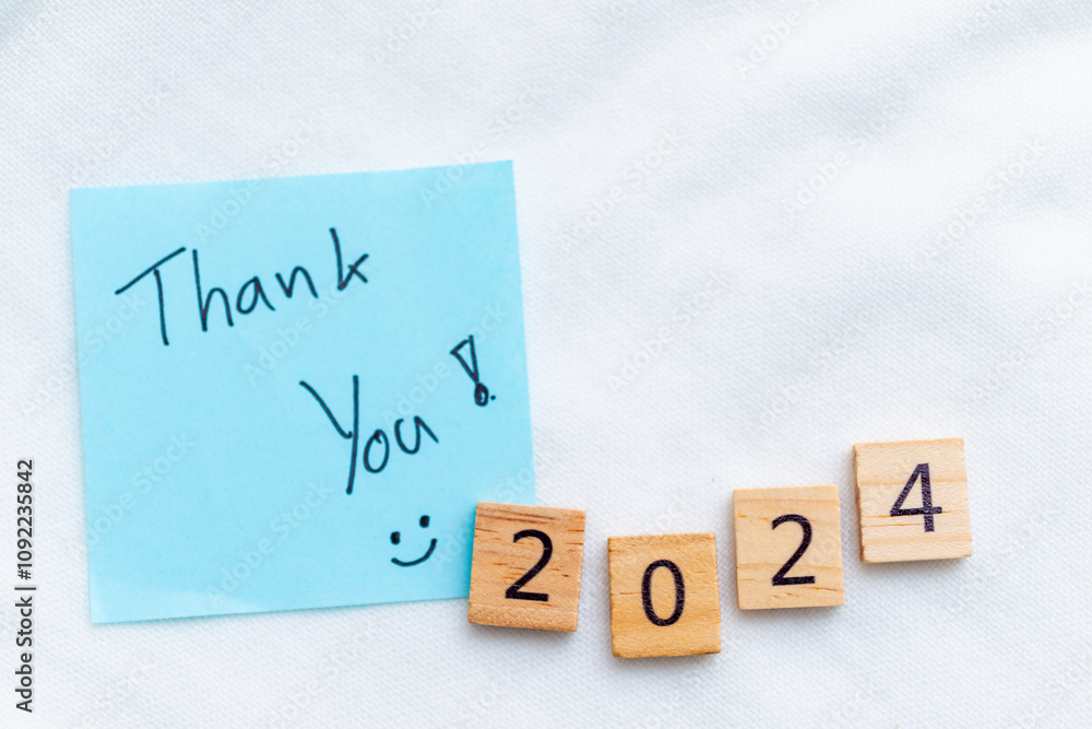 Aufkleber Gratitude for 2024 a business perspective on the new year desk setting note and blocks motivational environment close-up view reflection