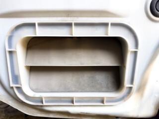 Rear air vent of car body close-up. The vents are usually positioned behind the back bumper on the...