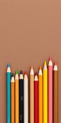 Assortment of vibrant wooden color pencils on textured brown backdrop, artistic, colorful