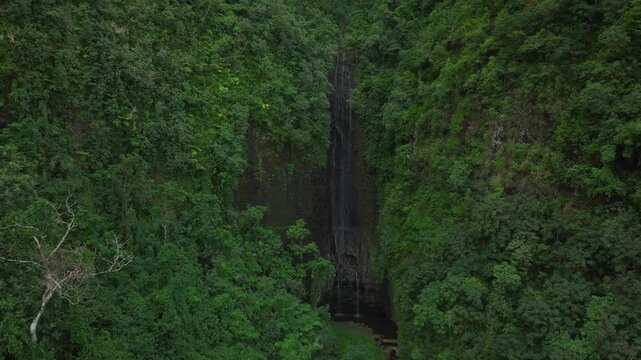 Vairao Taiarapu Vaimahutu Faarumai Matiti Waterfall Falls Tahiti Island French Polynesia aerial drone road to Teahupoo dense lush green jungle forest Les Trios Cascades pool nature forward pan up