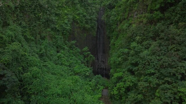 Vairao Taiarapu Vaimahutu Faarumai Matiti Waterfall Falls Tahiti Island aerial drone French Polynesia road to Teahupoo dense lush green jungle forest Les Trios Cascades pool nature backwards motion