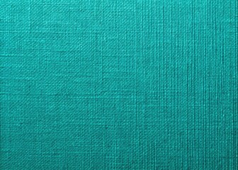 Fototapeta premium Elevate your crafting and design projects with this blue-green linen textured cardstock background, ideal for artistic creations. Its unique texture enhances any project beautifully.