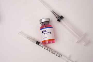 a liquid vitamin b12 with 2 syringes on the clinic table. health and medical concepts