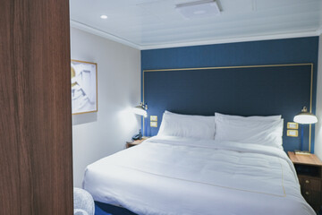 Luxurious interior or inside cabin stateroom on luxury ocean cruiseship or cruise ship liner in...