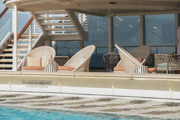 Outdoor Swimmingpool with wake aft deck views and lounge sun loungers and deck chairs furniture on...