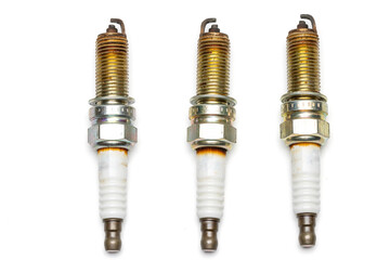 used spark plug with burned marks. isolated in white background.