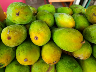 Fresh Green Mangoes Displayed in a Market