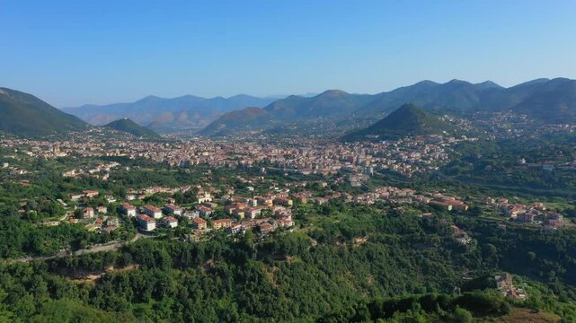 Aerial view from high altitude of rocky mountains and houses on hills near Vietri Sul Mare on a sunny summer day, Raite, Salerno, Italy
