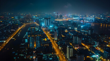 Fototapeta premium Aerial perspective of a city illuminated at night, capturing its urban landscapes