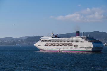 Classic cruiseship cruise ship liner Ambience sail away departure from Vigo port, Spain in Galicia...