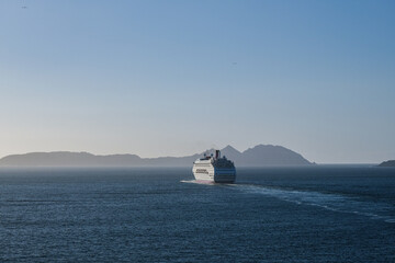Classic cruiseship cruise ship liner Ambience sail away departure from Vigo port, Spain in Galicia...