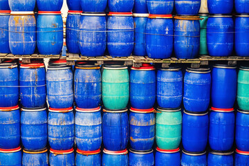 Blue plastic barrels in an industrial warehouse