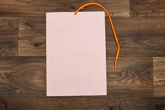 Pink Blank A4 photorealistic brochure mockup with orange rope wooden table