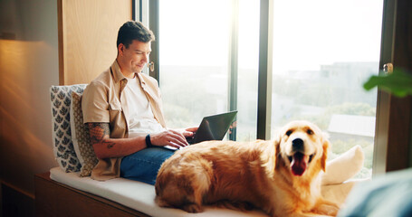 Man, laptop and dog on couch in home, window and remote work with reading, review and feedback for...