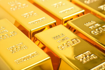 Close up of Many shiny gold bars as background. Rows of Gold bars. Financial concept.