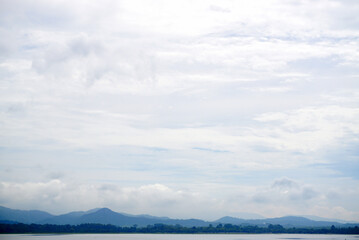 Fototapeta premium Nature landscape background, Lake and forest with mountain and clouds sky background