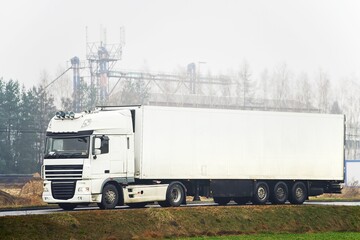 Professional truck drivers delivering cargo on highway
