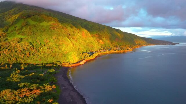 North Shore beach Vallee de Tautira Bay River Tahiti island French Polynesia aerial drone morning golden yellow sunrise valley village neighborhood Teahupoo Taiarapu Taravao circle right motion