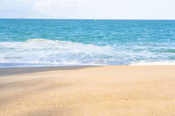 Sandy beach with turquoise sea in Nha Trang, Vietnam. Perfect for use as a background or for product placement in photo editors. Clean, minimalistic composition creates an atmosphere of summer.