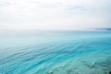 Obraz premium Softly glowing blue azure watercolor with delicate wispy brushstrokes on a light gray background, peaceful scene, serene atmosphere