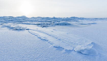 Landscape with broken ice shards laying on the coast of Baltic Sea