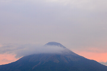The scenery of Foggy day view at Mount Penanggungan trails with Sunrise Sky View in the morning.
