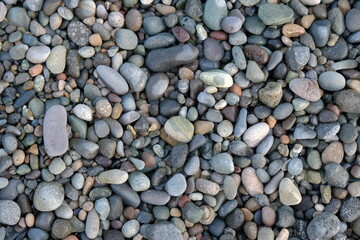 stones background. natural background stones on the beach. multi-colored pebbles with rounded stones as a background