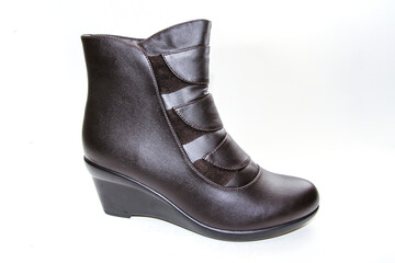 Women's boots. Short-throated. On a white background. Side view.