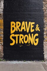 Fototapeta premium Bold Graffiti Art on Urban Brick Wall with Motivational Message 