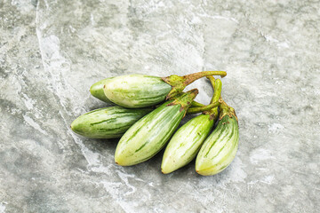 Small organic young green eggplant
