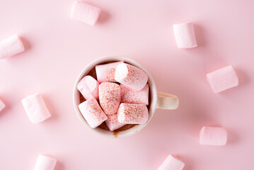 Chocolate drink with marshmallows in a mug on a pink background. Vegan, sugar and lactose free. Top...
