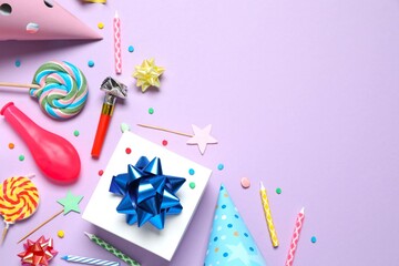 Frame of different party items and decorations with space for text on color background, flat lay