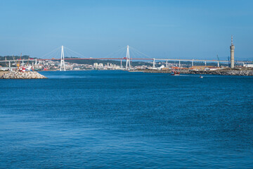 Obraz premium View across the water to the Edgar Cardoso Bridge over the Mondego River in Figueira da Foz, Portugal