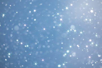 Obraz premium blue snowfall bokeh background, abstract snowflake background on blurred abstract blue