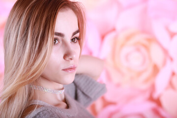Girl with blond hair and gray sweater