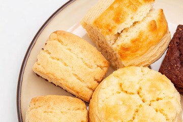 Fototapeta premium Homemade Biscuits and Scones with Chocolate Cake on a Serving Plate