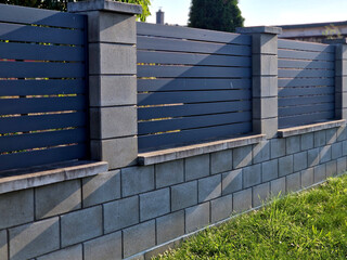 metal fillings of the fence with an underlay of concrete blocks. A metal aluminum fence will...